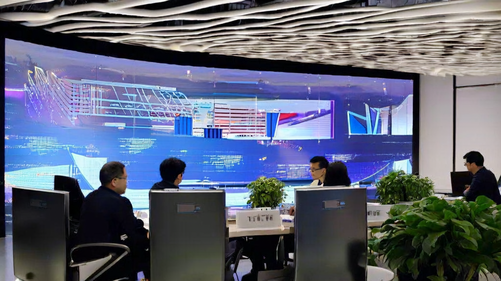 现代办公室内员工通过大屏幕监控AI智能获客系统的运行情况